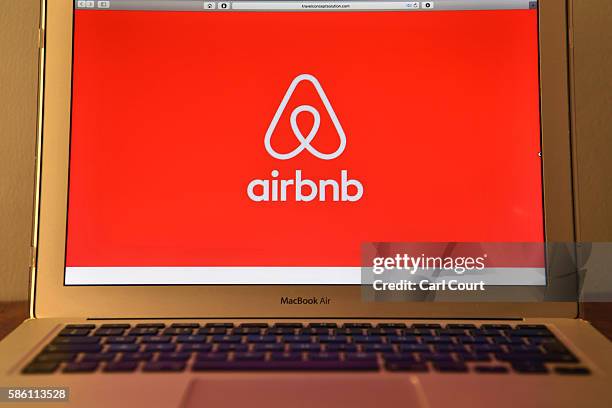 The Airbnb logo is displayed on a computer screen on August 3, 2016 in London, England.