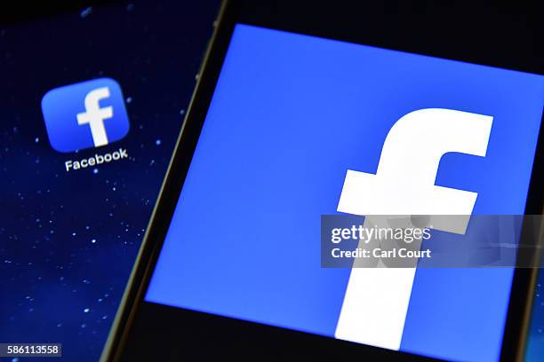 The Facebook app logo is displayed on an iPad next to a picture of the Facebook logo on an iPhone on August 3, 2016 in London, England.