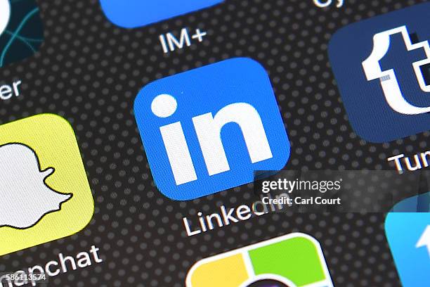 The LinkedIn app logo is displayed on an iPhone on August 3, 2016 in London, England.