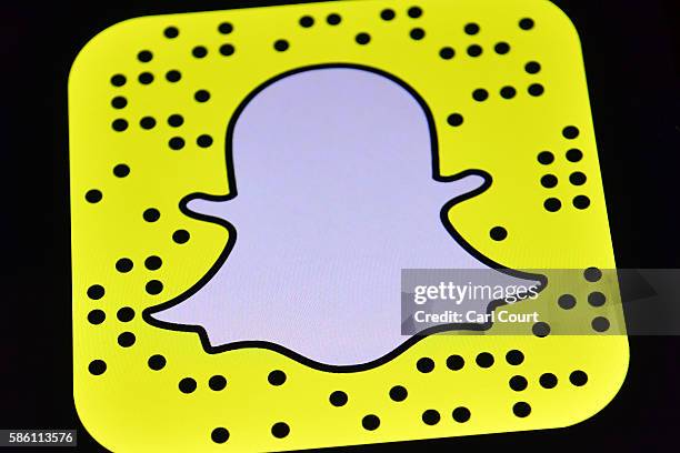 The Snapchat app logo is displayed on an iPad on August 3, 2016 in London, England.