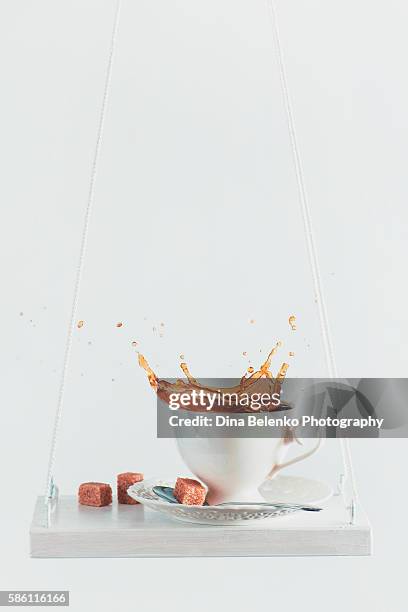 splash of morning coffee - coffee slow motion stock pictures, royalty-free photos & images