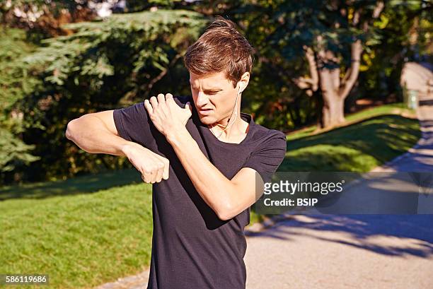 Man suffering from shoulder pain.
