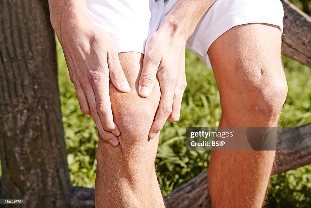 Man suffering from knee pain