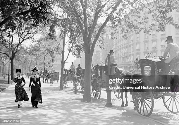 Two Women Strolling Near Cab Stand, Madison Square, New York City, USA, circa 1900.