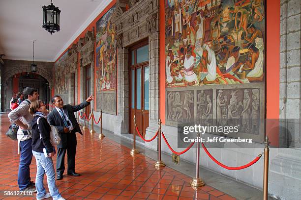 Mexico, Mexico City, Distrito Federal, historic center, Zocalo, Plaza de la Constitucion, National Palace, guide pointing.