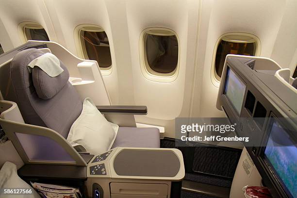 Air China flight to Beijing, business class cabin, reclining chair.