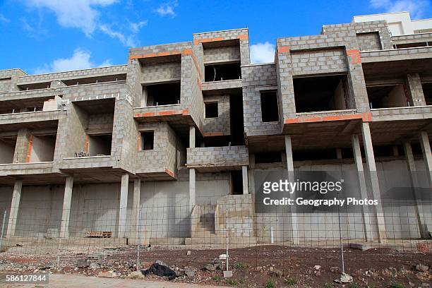 Concrete shells of uncompleted housing in the Castillo development, Caleta de Fuste, Fuerteventura, Canary Islands, Spain.