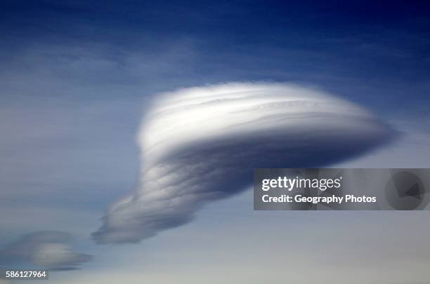 Lenticular cloud, altocumulus, lenticularis, formed over Alpujarras mountains, Almeria, Spain.