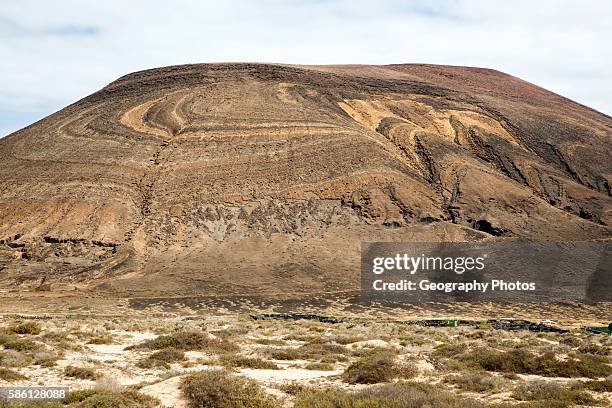 Unusual patterned rock strata on Agujas Grandes volcano, La Isla Graciosa, Lanzarote, Canary Islands, Spain.