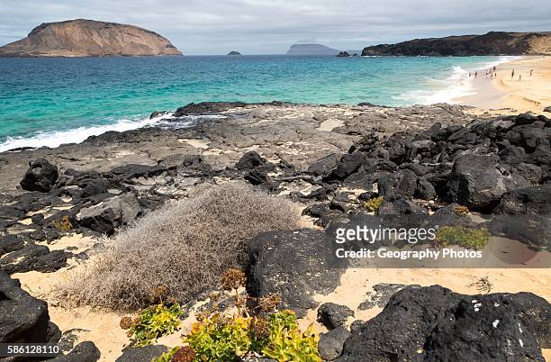 Montana Clara island nature reserve and sandy beach Playa de las Conchas, Graciosa island, Lanzarote, Canary Islands, Spain.