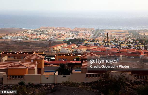 View over rooftops of villa housing in the Castillo development, Caleta de Fuste, Fuerteventura, Canary Islands, Spain.
