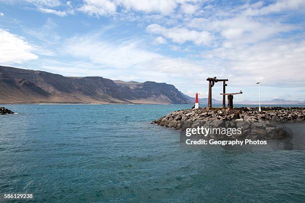 Entrance to Caleta de Sebo harbor La Isla Graciosa, with distant views of cliffs in Lanzarote, Canary Islands, Spain.