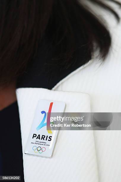 The Mayor of Paris, Anne Hidalgo wears a Paris 2024 pin badge while talking at a press conference given by the Paris 2024 Candidate Olympic City...