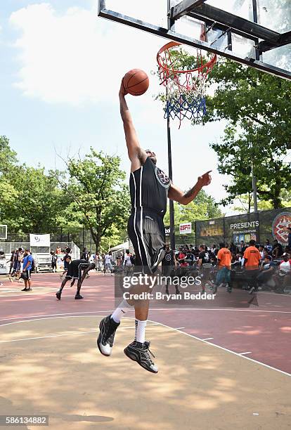 An athlete participates in a basketball game during the Launch of the new Reebok Question Mid EBC & A5 with Cam'ron and Jadakiss at Rucker Park on...