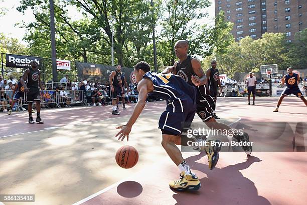 Athletes participate in a basketball game during the Launch of the new Reebok Question Mid EBC & A5 with Cam'ron and Jadakiss at Rucker Park on...