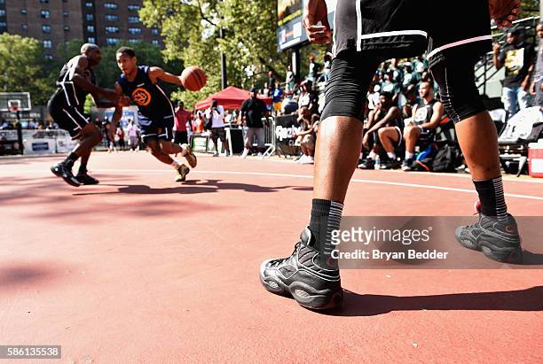 Athletes participate in a basketball game during the Launch of the new Reebok Question Mid EBC & A5 with Cam'ron and Jadakiss at Rucker Park on...