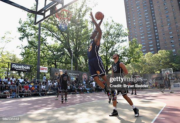 Athletes participate in a basketball game during the Launch of the new Reebok Question Mid EBC & A5 with Cam'ron and Jadakiss at Rucker Park on...