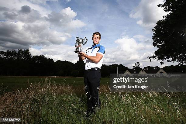 Matthew Webb of Bedlingtonshire GC poses with the trophy following his victory in the PGA Assistants Championships at Little Aston Golf Club on...