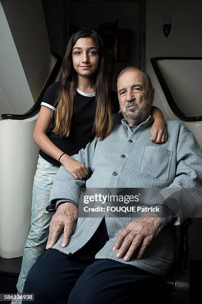 Jean-Claude Carriere with his daugther Kiara pose for Paris Match at home on september 22, 2015 in Paris, France.