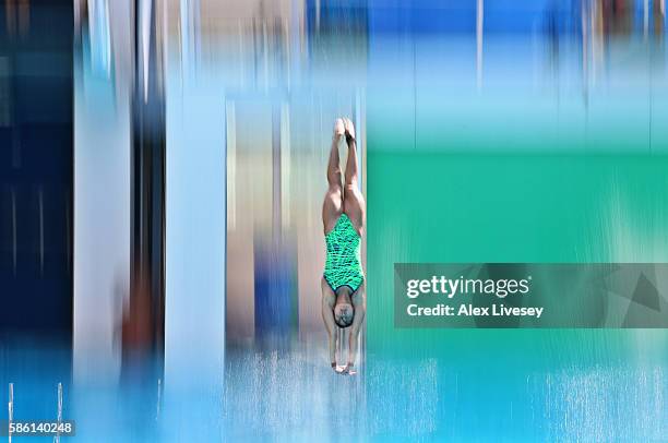 Diver enters the water during a training session at the Maria Lenk Aquatics Centre on August 5, 2016 in Rio de Janeiro, Brazil.