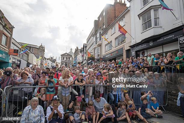 Crowds of people wait for the giant 12-metre tall Man Engine to be unveiled to the public in Penzance on August 5, 2016 in Cornwall, England. Said to...
