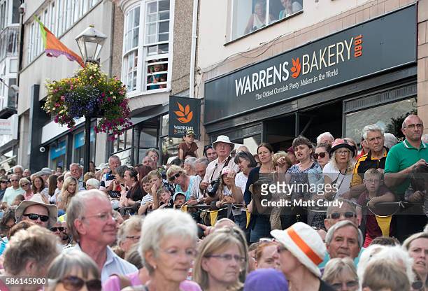 Crowds of people wait for the giant 12-metre tall Man Engine to be unveiled to the public in Penzance on August 5, 2016 in Cornwall, England. Said to...
