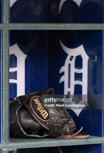 Detailed view of a Wilson baseball glove sitting in the dugout prior to the game between the Detroit Tigers and the Kansas City Royals at Comerica...