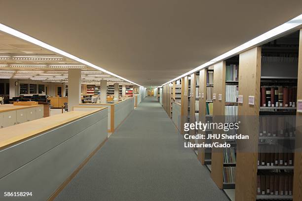Stacks full of books and study spaces on A-Level of the Milton S. Eisenhower Library on the Homewood campus of the Johns Hopkins University in...