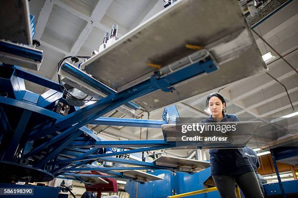 woman textile printing at a factory - textile printing stock pictures, royalty-free photos & images