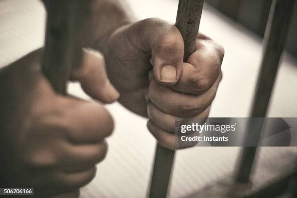 incarceration - hands on prison bars stock pictures, royalty-free photos & images