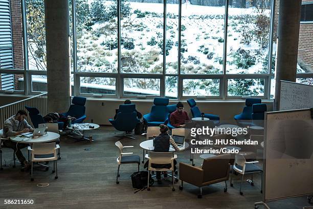 Students study in the Brody Learning commons, an interactive/collaborative study space and library, while it is a snow day on the Homewood campus of...