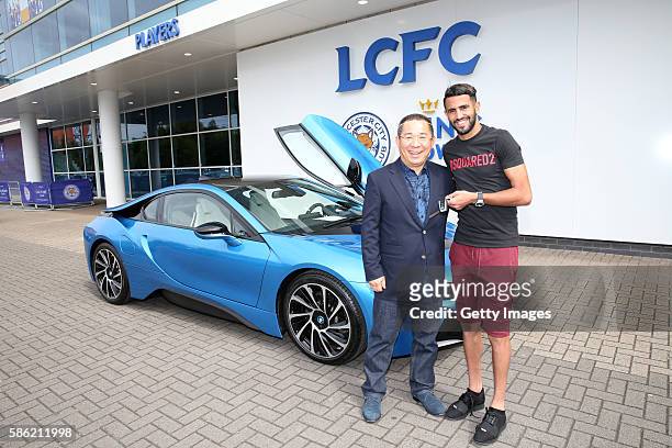 Riyad Mahrez accepts the gifts on behalf of the team from chairman Vichai Srivaddhanaprabha, a fleet of 19 protonic blue BMW I8s were parked outside...