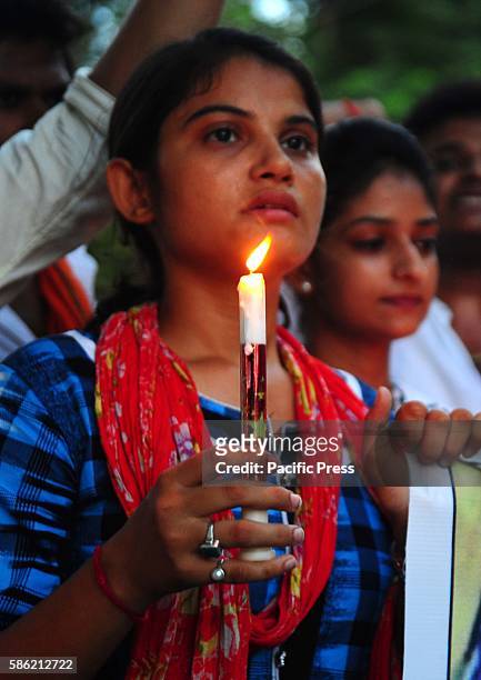 Students hold a candle march protest against bulandshahr rape case in Allahabad. A woman and her 14-year-old daughter were raped by a gang of dacoits...