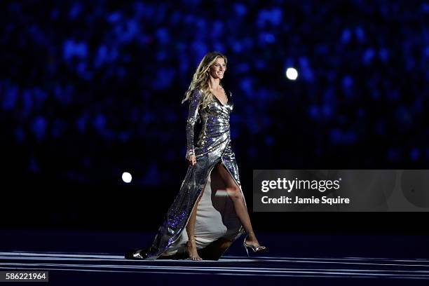 Supermodel Gisele Bundchen walks as The Girl From Ipanema during the Bossa segment during the Opening Ceremony of the Rio 2016 Olympic Games at...