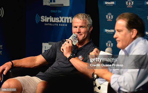 Brett Farve speaks to Steve Mariucci during the SirusXM's Town Hall at Umstattd Hall at The Zimmerman Symphony Center on August 5, 2016 in Canton,...