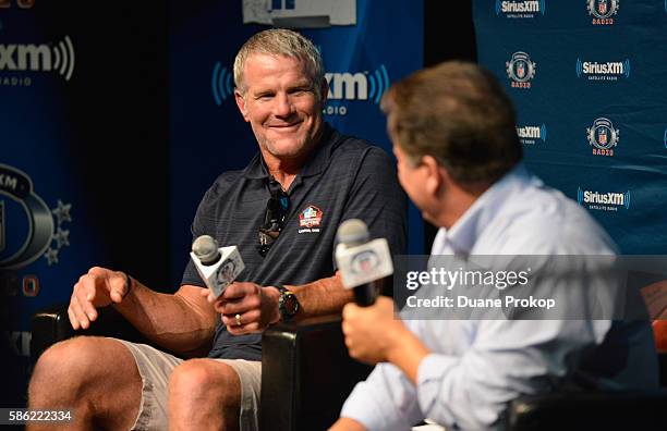 Brett Farve speaks to Steve Mariucci during the SirusXM's Town Hall at Umstattd Hall at The Zimmerman Symphony Center on August 5, 2016 in Canton,...