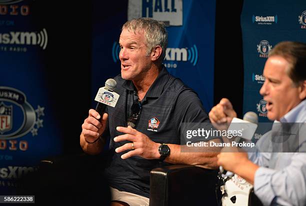 Brett Farve speaks to Steve Mariucci during the SirusXM's Town Hall at Umstattd Hall at The Zimmerman Symphony Center on August 5, 2016 in Canton,...