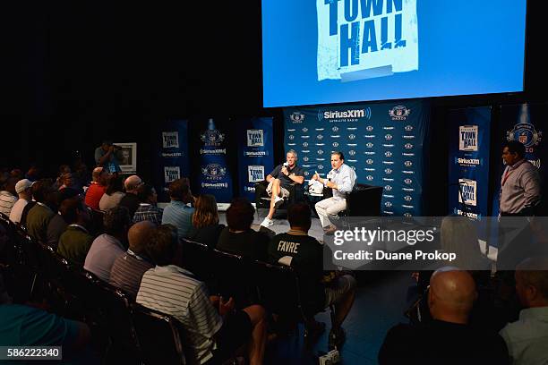 Brett Farve speaks to Steve Mariucci during the SirusXM's Town Hall at Umstattd Hall at The Zimmerman Symphony Center on August 5, 2016 in Canton,...