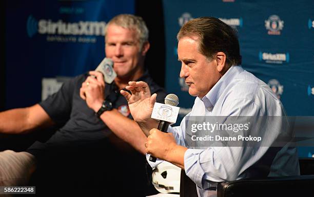 Brett Farve speaks to Steve Mariucci during the SirusXM's Town Hall at Umstattd Hall at The Zimmerman Symphony Center on August 5, 2016 in Canton,...