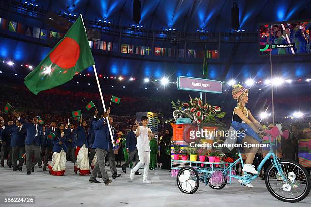 Mohammad Rahman of Bangladesh carries the flag during the Opening Ceremony of the Rio 2016 Olympic Games at Maracana Stadium on August 5, 2016 in Rio...