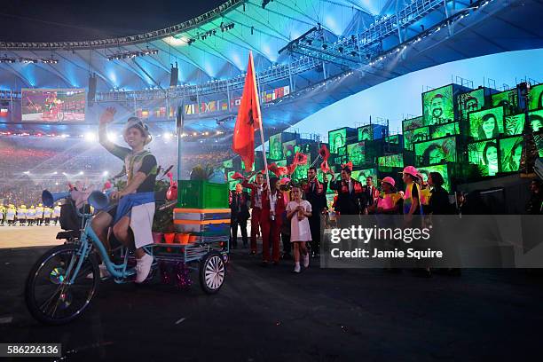 Flag bearer Luiza Gega of Albania leads her team during the Opening Ceremony of the Rio 2016 Olympic Games at Maracana Stadium on August 5, 2016 in...