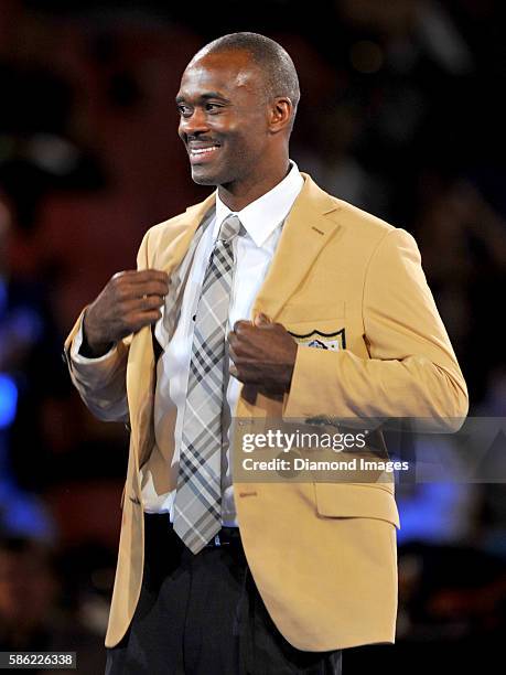 Hall of Fame enshrinee, wide receiver Marvin Harrison receives his gold jacket during the Pro Football Hall of Fame Gold Jacket Dinner on August 4,...