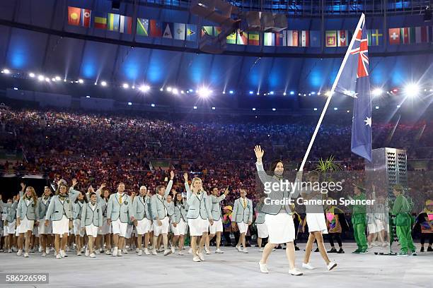 Anna Meares of Australia carries the flag during the Opening Ceremony of the Rio 2016 Olympic Games at Maracana Stadium on August 5, 2016 in Rio de...