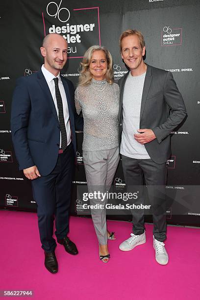 Michael Lungkofler, Center Manager Designer Outlet Soltau and Sylvie Mutschler and Jahn Hahn during the late night shopping at Designer Outlet Soltau...