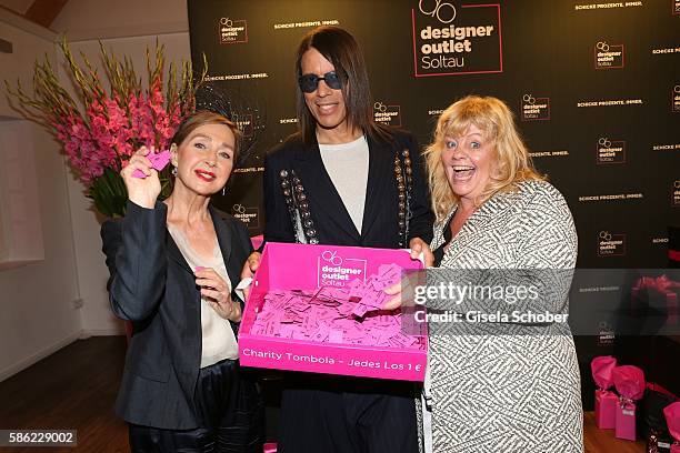 Christine Kaufmann, Jorge Gonzalez and Inger Nilsson during the late night shopping at Designer Outlet Soltau on August 5, 2016 in Soltau, Germany.