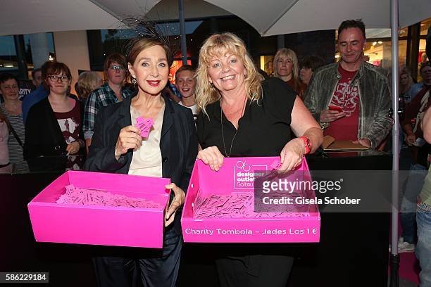 Christine Kaufmann and Inger Nilsson during the late night shopping at Designer Outlet Soltau on August 5, 2016 in Soltau, Germany.