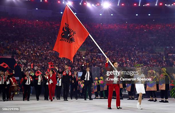 Luiza Gega of Albania carries the flag during the Opening Ceremony of the Rio 2016 Olympic Games at Maracana Stadium on August 5, 2016 in Rio de...