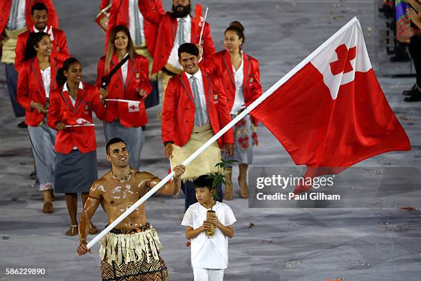 Flag bearer Pita Nikolas Aufatofua of Tonga leads his Olympic Team during the Opening Ceremony of the Rio 2016 Olympic Games at Maracana Stadium on...