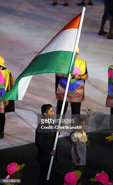Abhinav Bindra of India carries the flag during the Opening Ceremony of the Rio 2016 Olympic Games at Maracana Stadium on August 5, 2016 in Rio de...