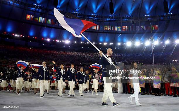 Sergei Tetiukhin of Russia carries the flag during the Opening Ceremony of the Rio 2016 Olympic Games at Maracana Stadium on August 5, 2016 in Rio de...